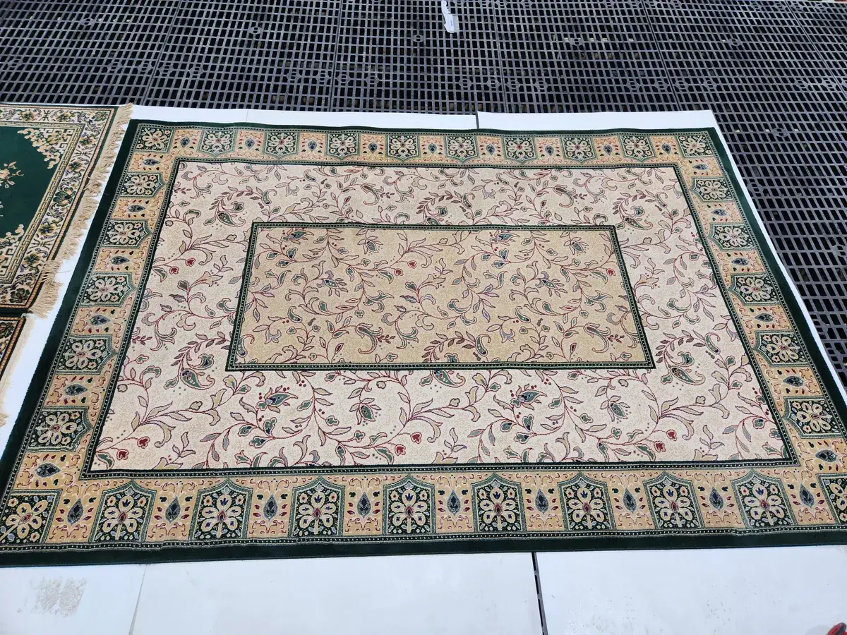 A silk rug being inspected at our Springfield, VA facility